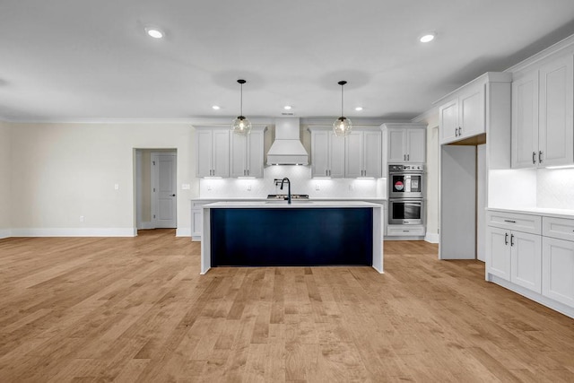 125 Drummond Pl, Covington, GA 30014 - kitchen with custom range hood, stainless steel double oven, light countertops, tasteful backsplash, and recessed lighting