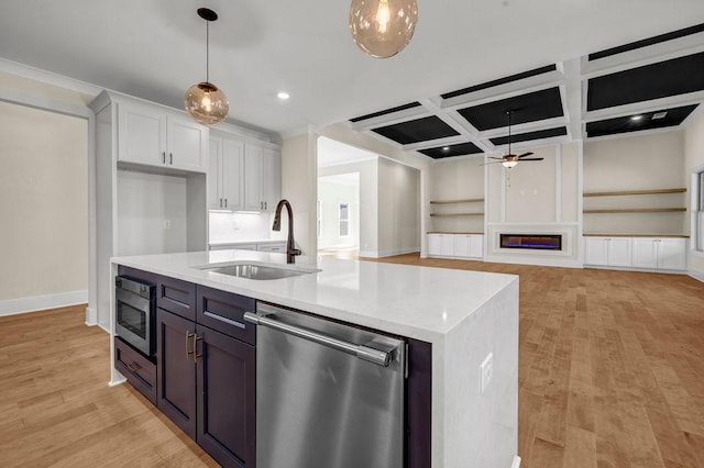 125 Drummond Pl, Covington, GA 30014 - kitchen with appliances with stainless steel finishes, a sink, ceiling fan, coffered ceiling, and pendant lighting