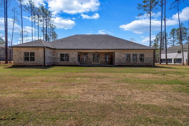 125 Drummond Pl, Covington, GA 30014 - back of property with a lawn, brick siding, and a shingled roof