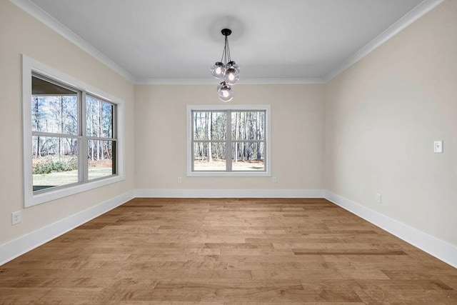 125 Drummond Pl, Covington, GA 30014 - unfurnished dining area with healthy amount of natural light, ornamental molding, light wood-type flooring, and baseboards