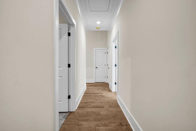 125 Drummond Pl, Covington, GA 30014 - hallway with attic access, wood finished floors, and baseboards