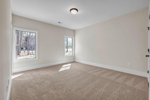 125 Drummond Pl, Covington, GA 30014 - spare room featuring carpet flooring and baseboards