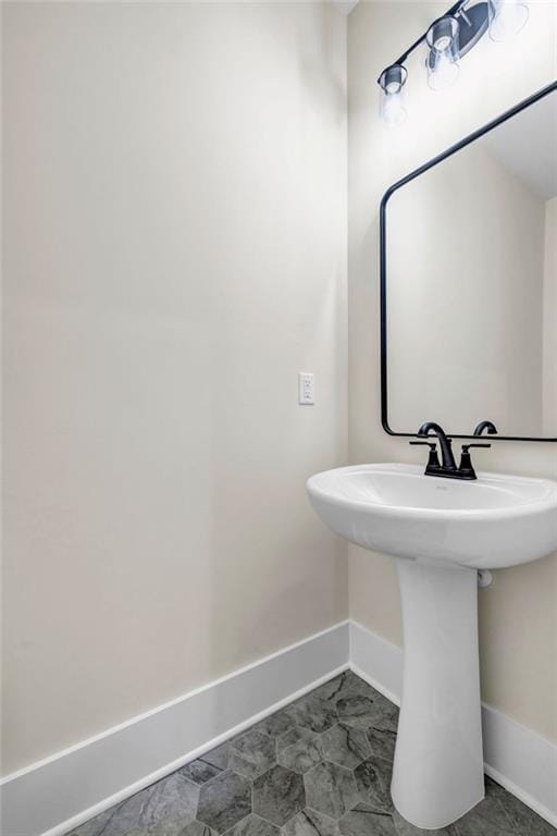 125 Drummond Pl, Covington, GA 30014 - bathroom featuring baseboards