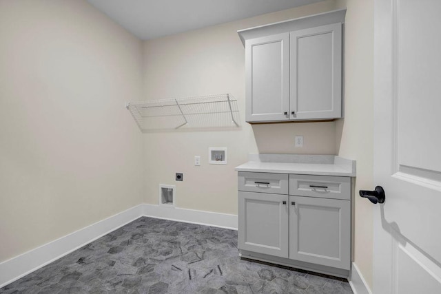 125 Drummond Pl, Covington, GA 30014 - washroom featuring hookup for an electric dryer, washer hookup, baseboards, and cabinet space