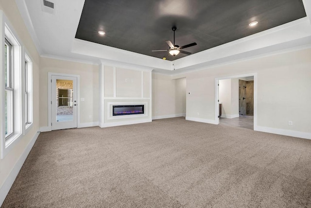 125 Drummond Pl, Covington, GA 30014 - unfurnished living room with a raised ceiling, carpet, ceiling fan, baseboards, and crown molding