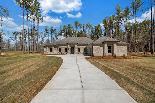 125 Drummond Pl, Covington, GA 30014 - view of front of house with a garage, driveway, and a front yard