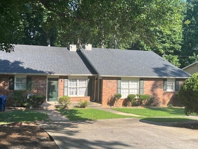231 Forest Pl, Lawrenceville, GA 30046 - view of front of property with brick siding and a chimney