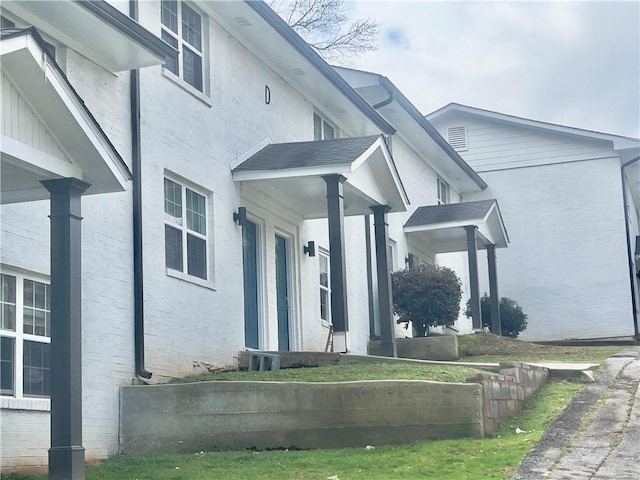 view of side of home featuring cooling unit