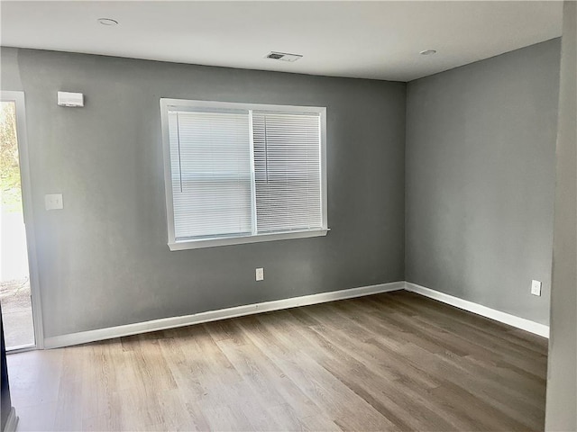 unfurnished room featuring wood-type flooring