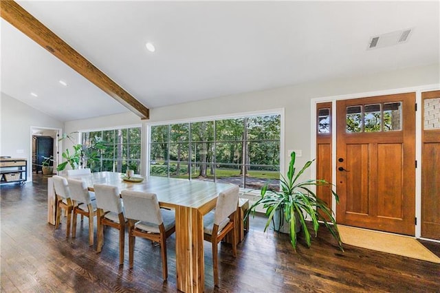 dining space featuring vaulted ceiling with beams and dark wood-type flooring