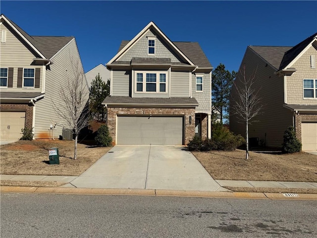 view of front of property featuring central AC unit and a garage