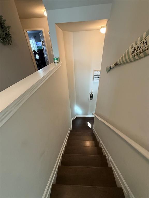 stairs featuring wood-type flooring