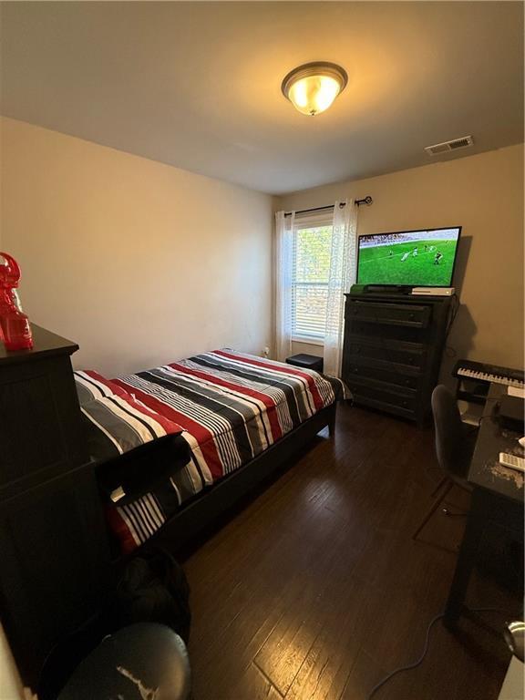 bedroom featuring dark hardwood / wood-style flooring