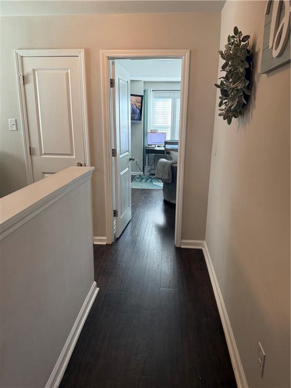 corridor with dark hardwood / wood-style floors