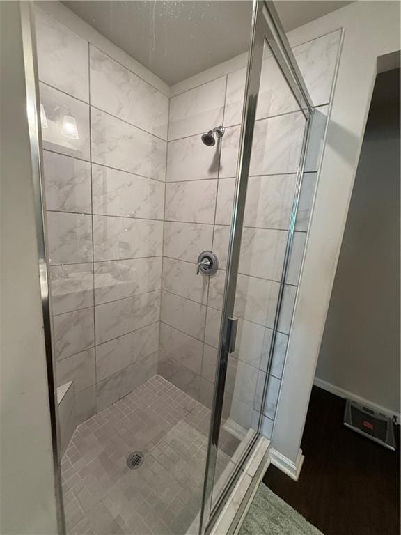 bathroom with tiled shower