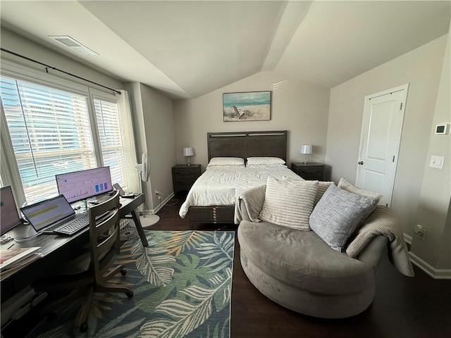 bedroom featuring dark hardwood / wood-style flooring and vaulted ceiling