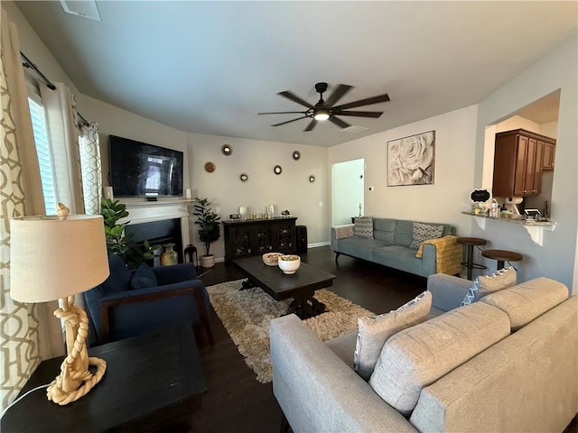 living room with ceiling fan and hardwood / wood-style floors