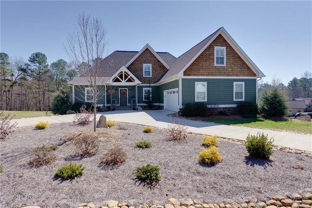 craftsman-style home with a garage and driveway