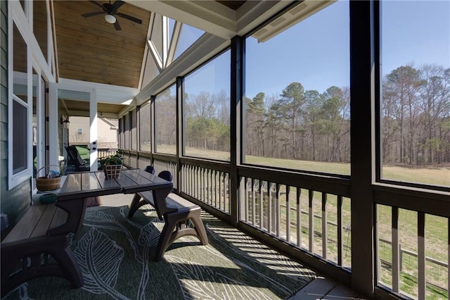 sunroom / solarium with a ceiling fan