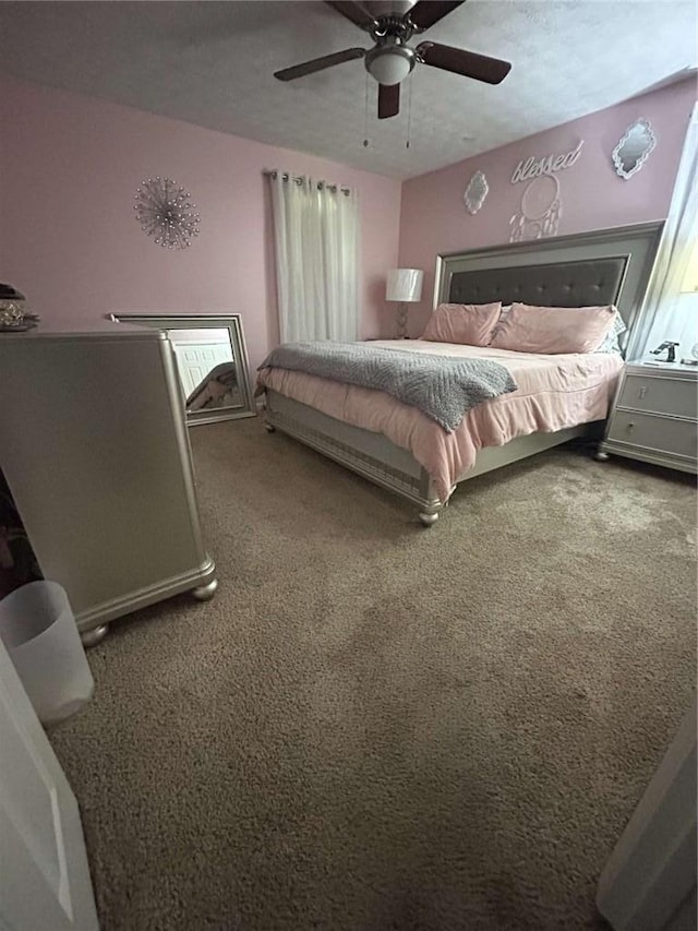 bedroom with carpet flooring and a ceiling fan