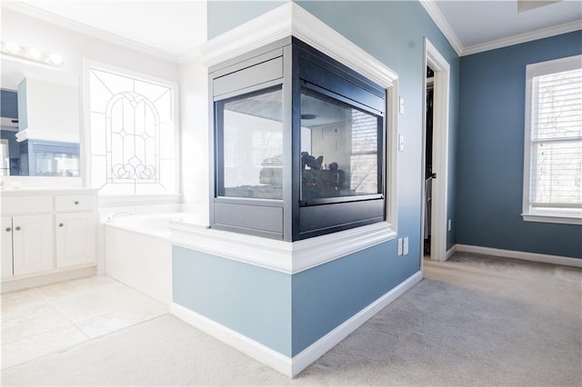 bathroom with vanity, a bathtub, and ornamental molding