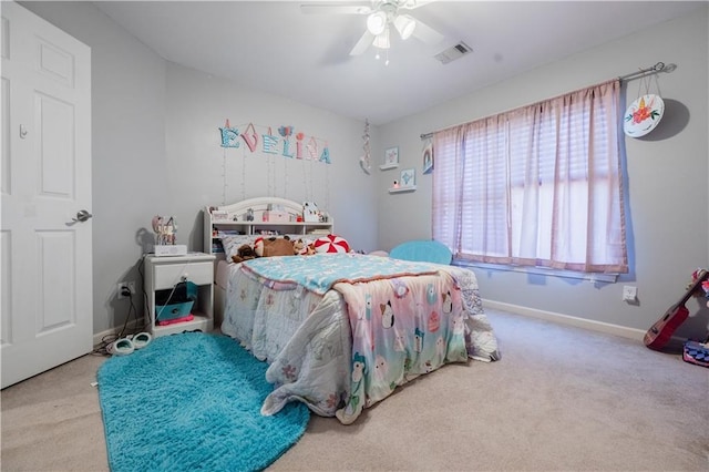 bedroom featuring light carpet and ceiling fan