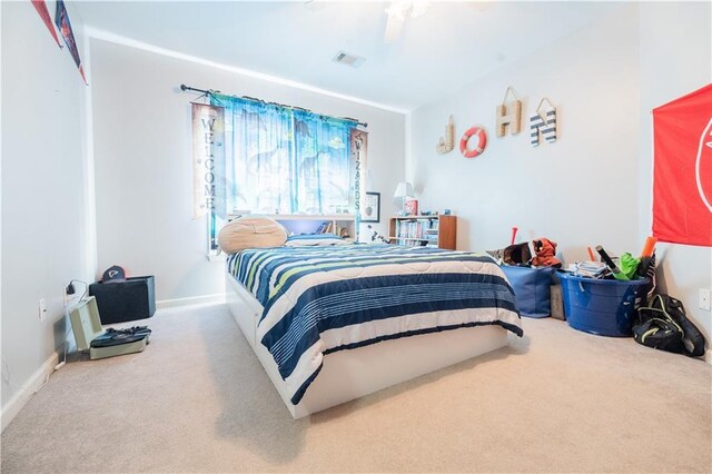 carpeted bedroom featuring ceiling fan