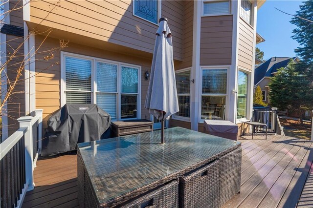 wooden terrace featuring grilling area