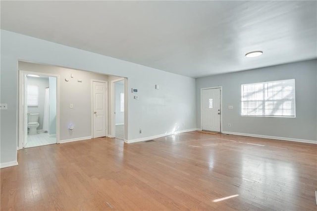 unfurnished room with light hardwood / wood-style floors