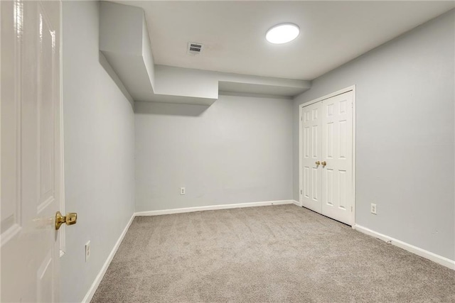 interior space with light colored carpet and a closet