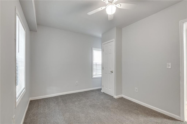 carpeted empty room with ceiling fan