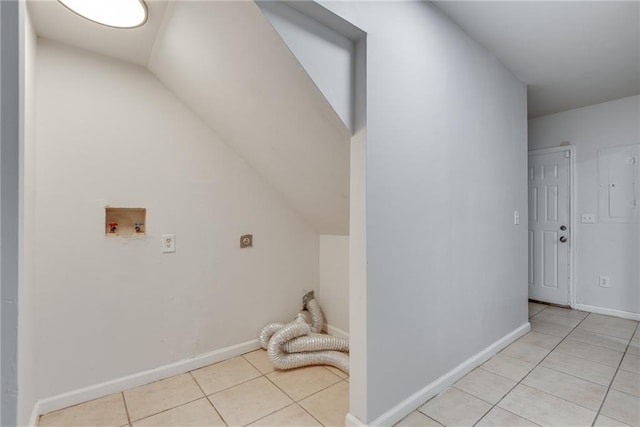 laundry area featuring light tile patterned floors, hookup for a washing machine, and hookup for an electric dryer