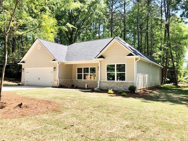 ranch-style home featuring a garage and a front yard