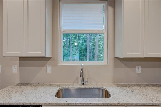 4230 Moore Rd, Conley, GA 30288 - kitchen with white cabinetry and light stone counters