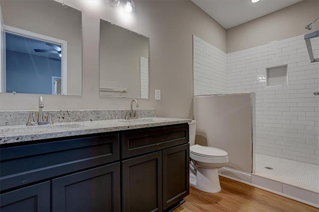 4230 Moore Rd, Conley, GA 30288 - full bath featuring double vanity, tiled shower, and wood finished floors