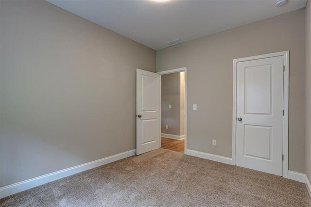 4230 Moore Rd, Conley, GA 30288 - unfurnished bedroom featuring carpet and baseboards
