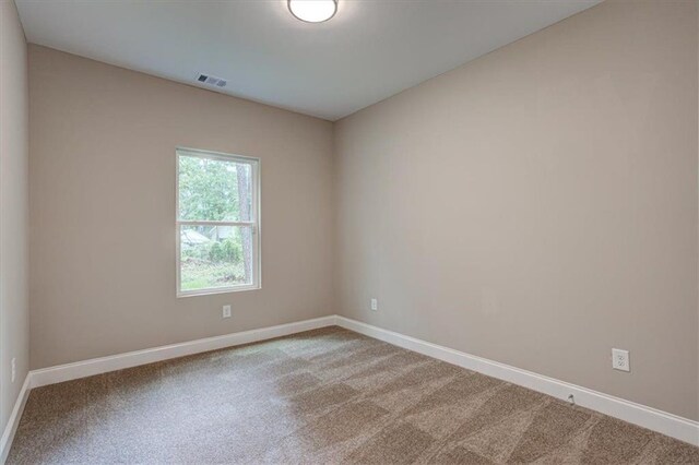 4230 Moore Rd, Conley, GA 30288 - empty room with carpet floors