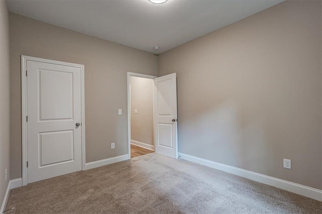 4230 Moore Rd, Conley, GA 30288 - unfurnished bedroom featuring carpet floors and baseboards