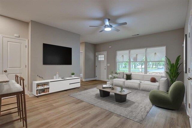 4230 Moore Rd, Conley, GA 30288 - living area featuring ceiling fan and light wood-style flooring