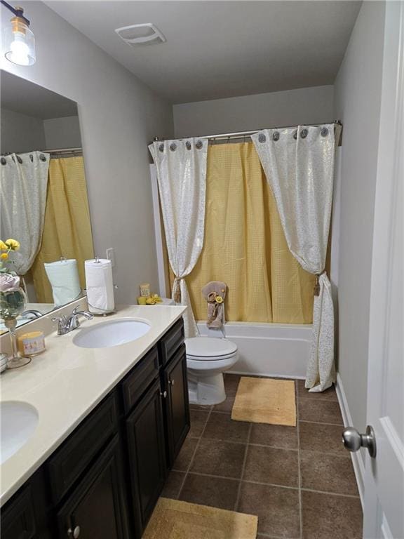 full bath with tile patterned flooring, toilet, a sink, shower / tub combo with curtain, and double vanity