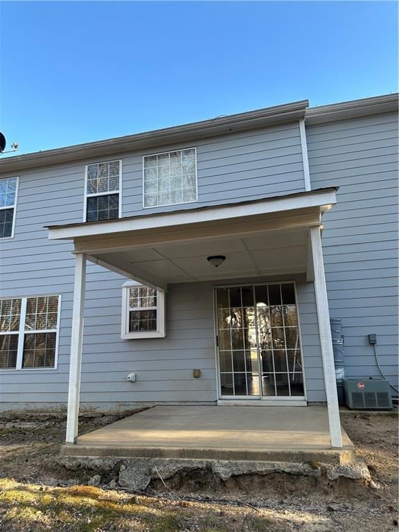 back of property with a patio