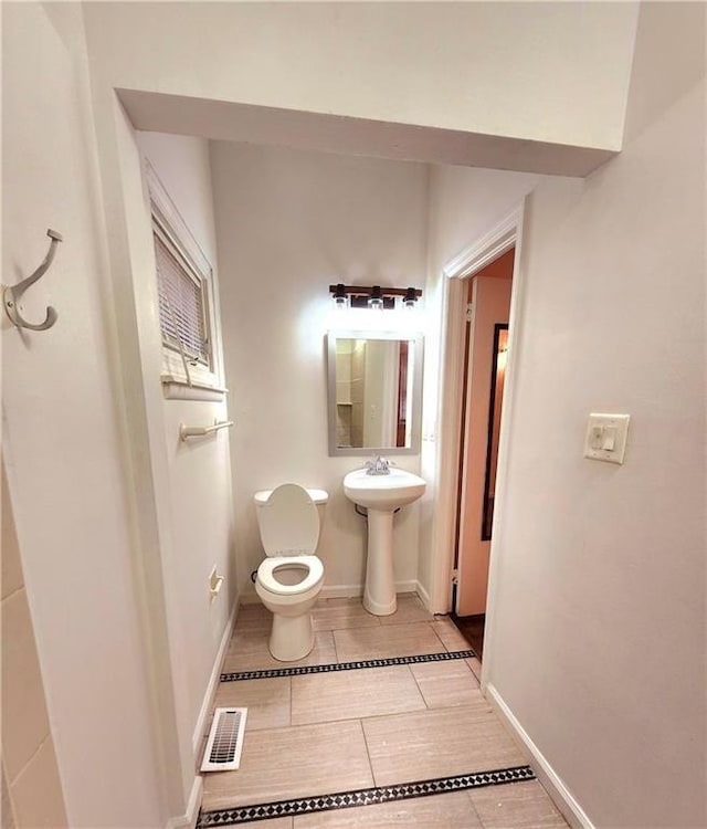 bathroom with toilet and sink