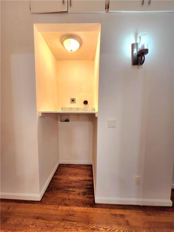 laundry room with hookup for a washing machine and dark wood-type flooring