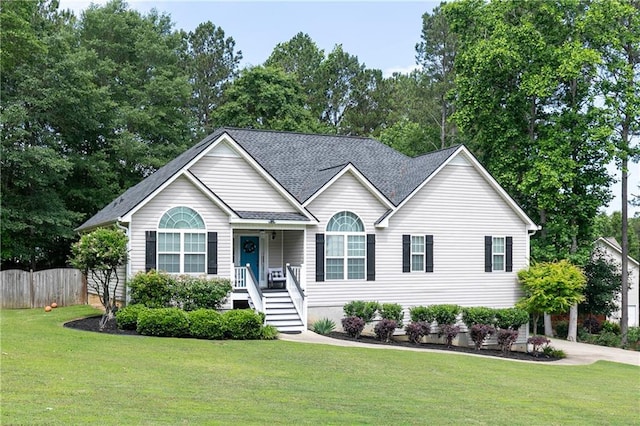 view of front of property with view of scattered trees and a shingled roof