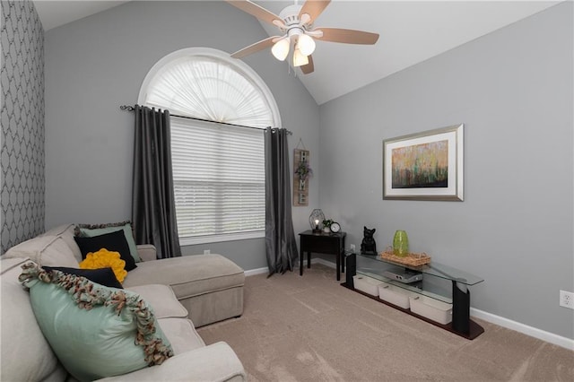 carpeted living room with vaulted ceiling, ceiling fan, healthy amount of natural light, and baseboards