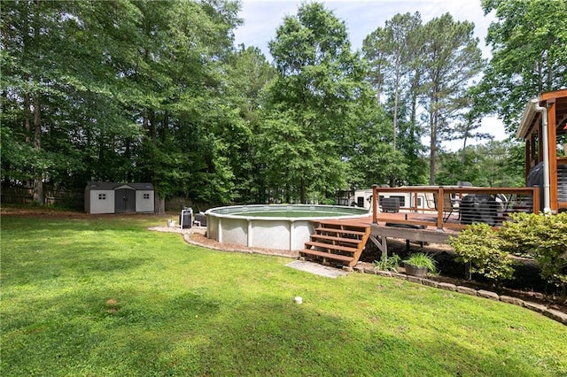 view of yard with a storage unit, a wooden deck, an outdoor structure, an outdoor pool, and view of scattered trees