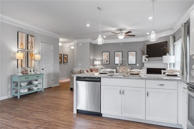 kitchen featuring dark wood-type flooring, light stone counters, white cabinets, hanging light fixtures, and stainless steel dishwasher