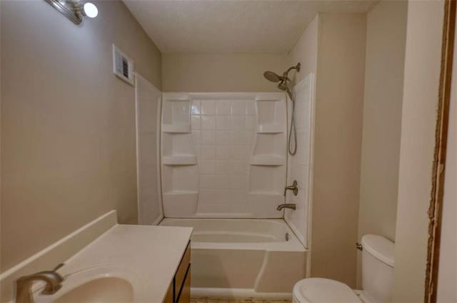 bathroom with visible vents, toilet, bathtub / shower combination, and vanity