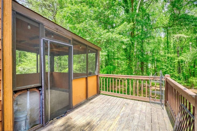wooden deck featuring a sunroom