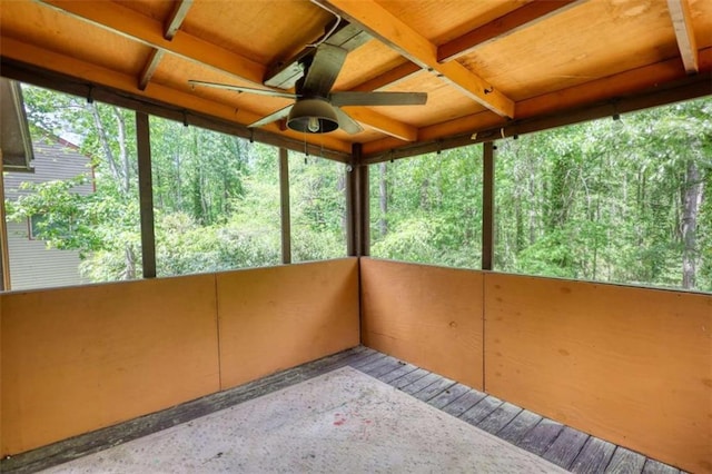 unfurnished sunroom featuring ceiling fan